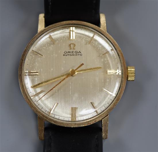 A gentlemans 1960s 9ct Omega automatic wrist watch, with associated leather strap.